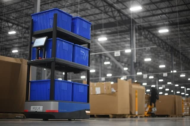 Autonomous mobile robot with cartons in a fulfillment center