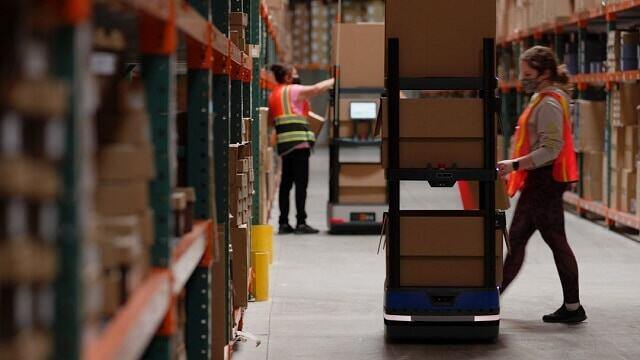 Associates working in a retail logistics warehouse